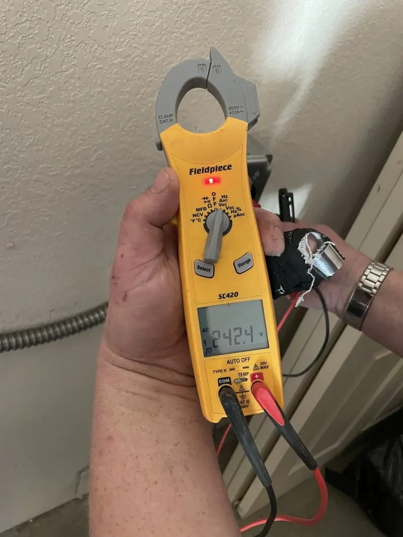 Voltage testing with clamp meter during Electrical Installation Services in Laguna Beach